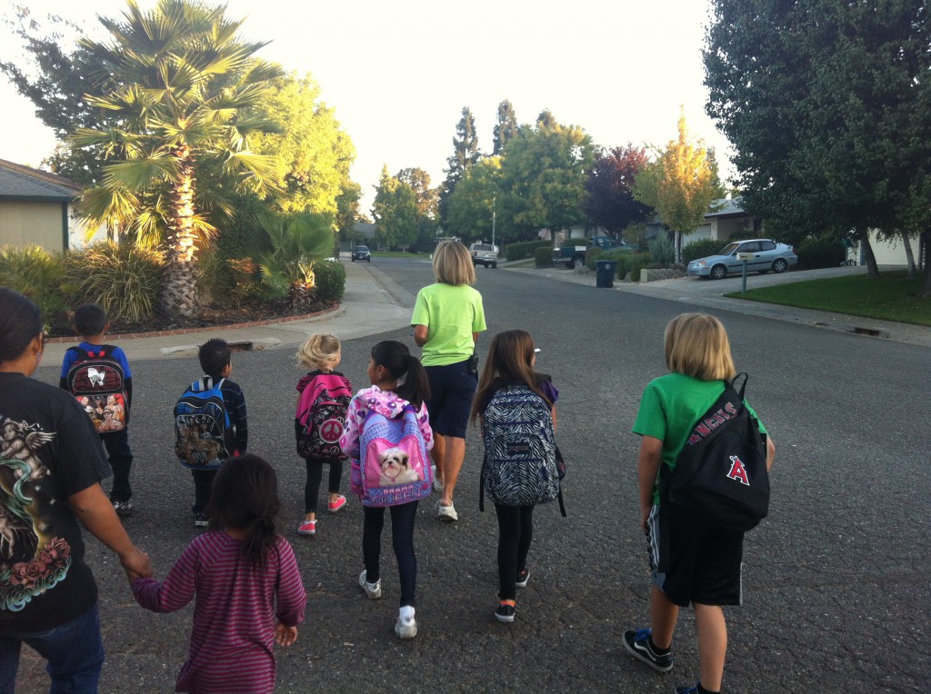 students walking to school with teacher